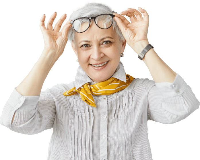 A mature woman happily taking off her glasses and treated cataract