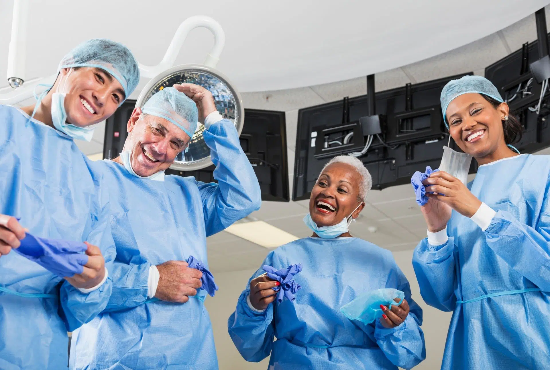 A group of cataract surgeons smiling because cataract surgery does not hurt