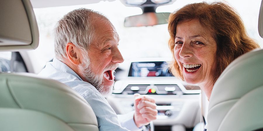 Happy couple able to see and drive after cataract surgery